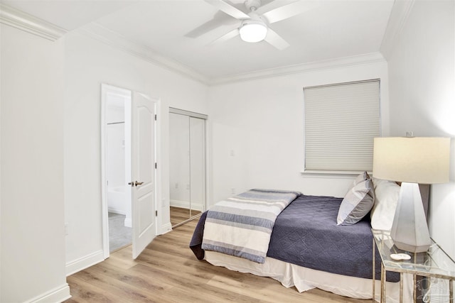 17075 Perdido Key Dr Unit 4E, Pensacola, FL 32507 - bedroom with crown molding, wood finished floors, ensuite bathroom, a ceiling fan, and baseboards