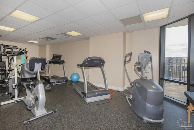 17075 Perdido Key Dr Unit 4E, Pensacola, FL 32507 - gym with expansive windows, a drop ceiling, and baseboards