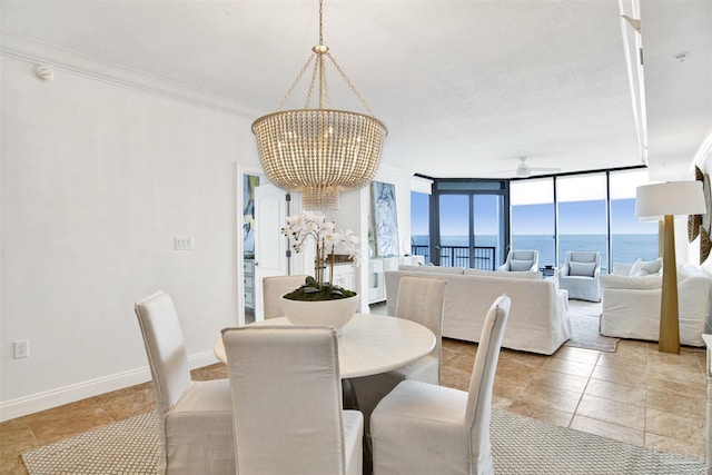 17075 Perdido Key Dr Unit 4E, Pensacola, FL 32507 - dining space with a chandelier, light tile patterned floors, crown molding, a water view, and expansive windows