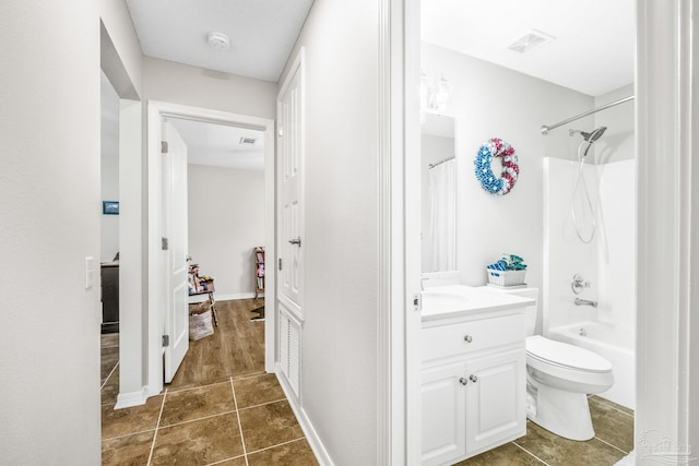 full bathroom with tile patterned flooring, vanity, shower / tub combo, and toilet