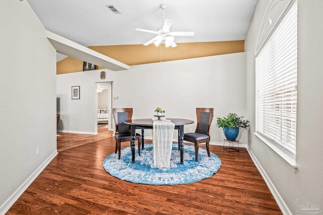 dining room featuring hardwood / wood-style flooring, ceiling fan, and lofted ceiling