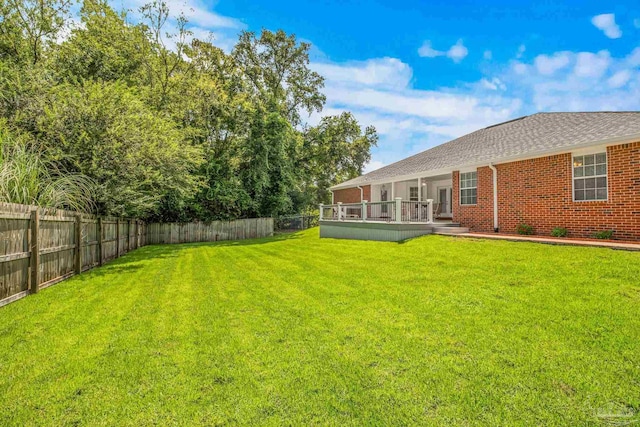 view of yard with a deck