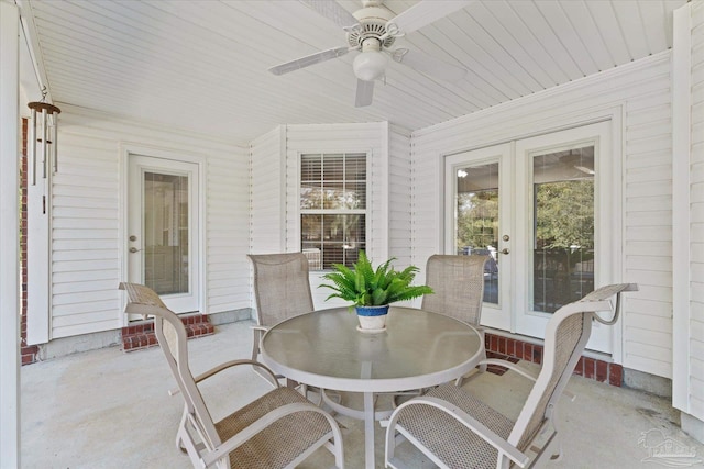 sunroom with a wealth of natural light and ceiling fan