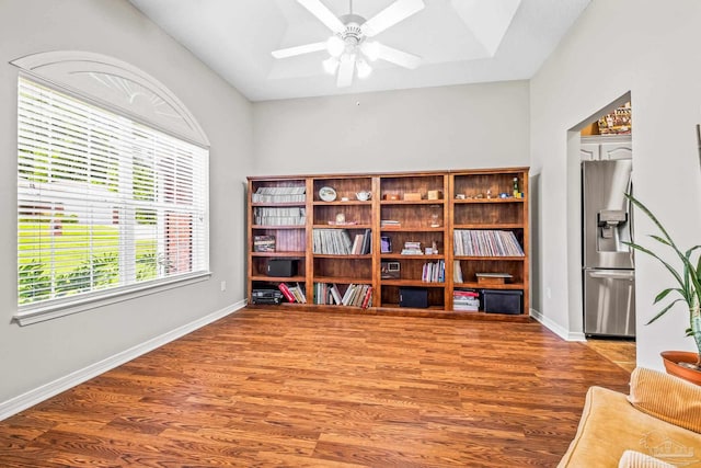 interior space featuring wood-type flooring and ceiling fan