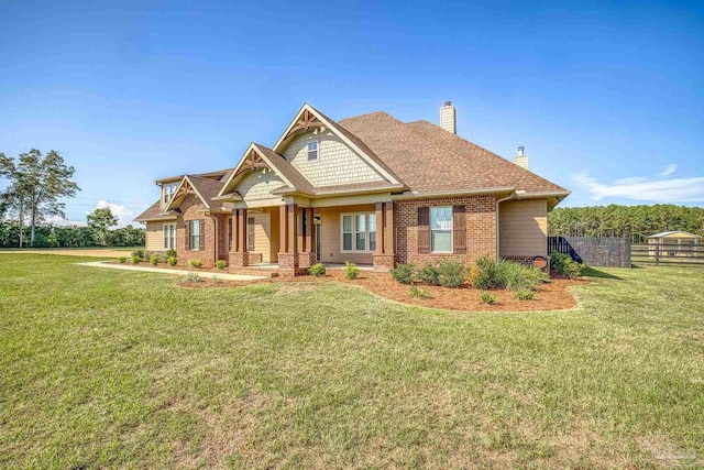 craftsman house featuring a front yard