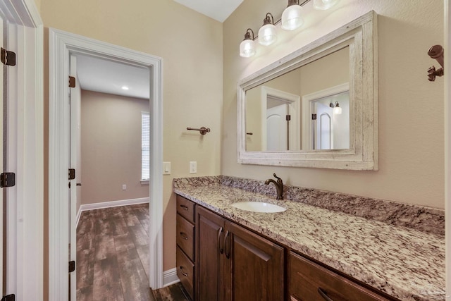 bathroom with vanity and wood-type flooring