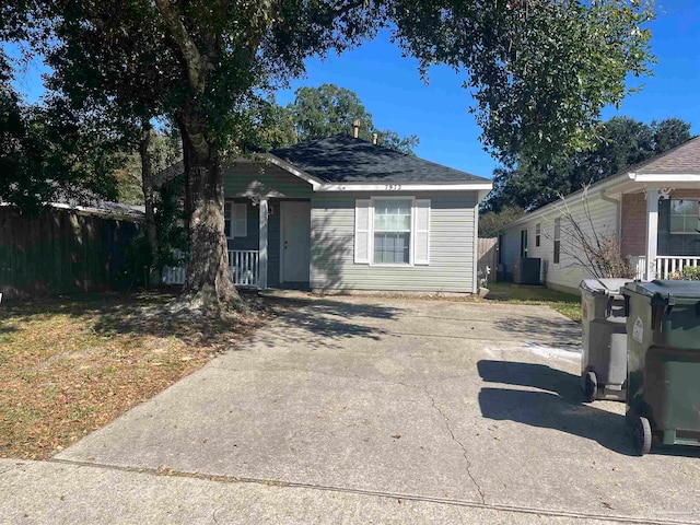 bungalow-style home with central AC unit