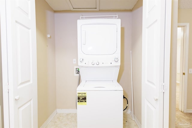 washroom with stacked washer / dryer