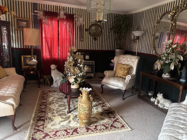 sitting room with wallpapered walls and carpet flooring