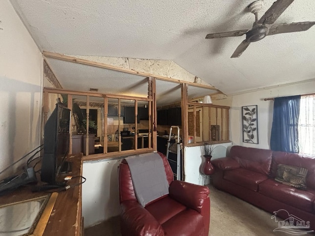 living room featuring a textured ceiling, a ceiling fan, and vaulted ceiling