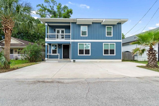 277 Seamarge Ln, Pensacola, FL 32507 - view of front of property with a balcony, a porch, and board and batten siding