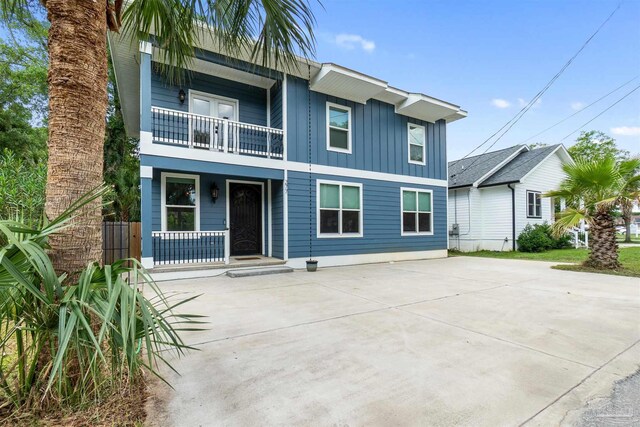277 Seamarge Ln, Pensacola, FL 32507 - view of front of house with a balcony, board and batten siding, and a porch