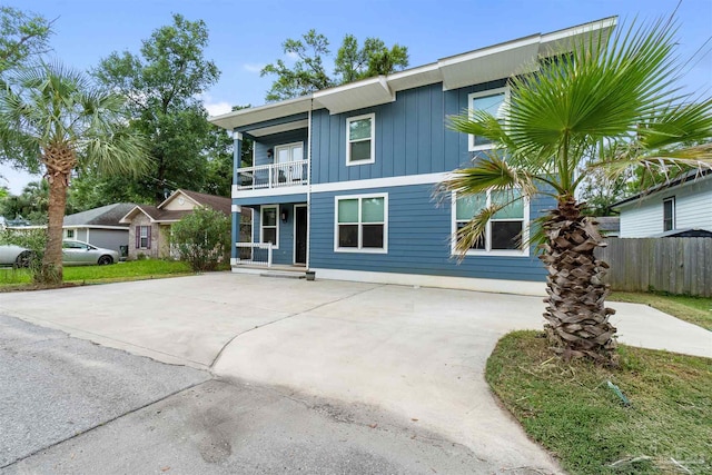 277 Seamarge Ln, Pensacola, FL 32507 - view of front of home featuring a balcony, board and batten siding, and concrete driveway
