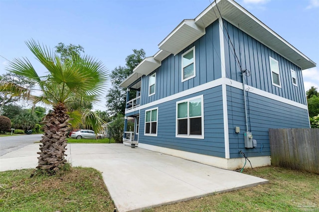 277 Seamarge Ln, Pensacola, FL 32507 - view of side of property with board and batten siding and concrete driveway