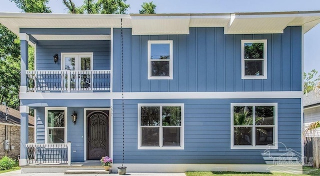 277 Seamarge Ln, Pensacola, FL 32507 - view of front of home with a balcony, board and batten siding, and a porch