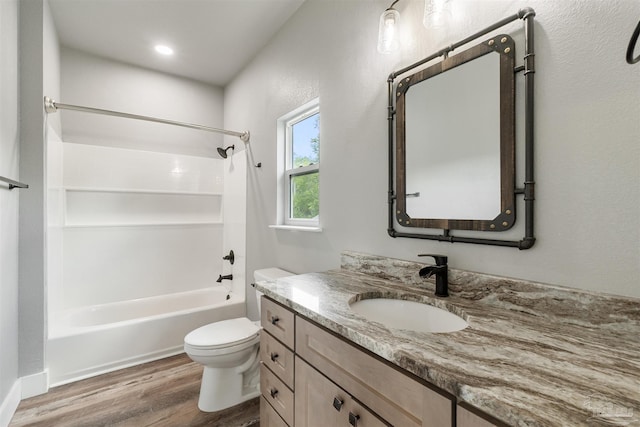 277 Seamarge Ln, Pensacola, FL 32507 - bathroom featuring toilet, vanity, wood finished floors, and bathing tub / shower combination