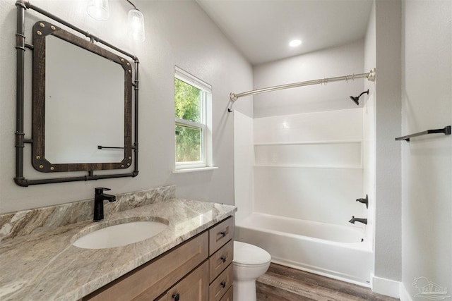 277 Seamarge Ln, Pensacola, FL 32507 - bathroom featuring wood finished floors, vanity, toilet, and bathtub / shower combination