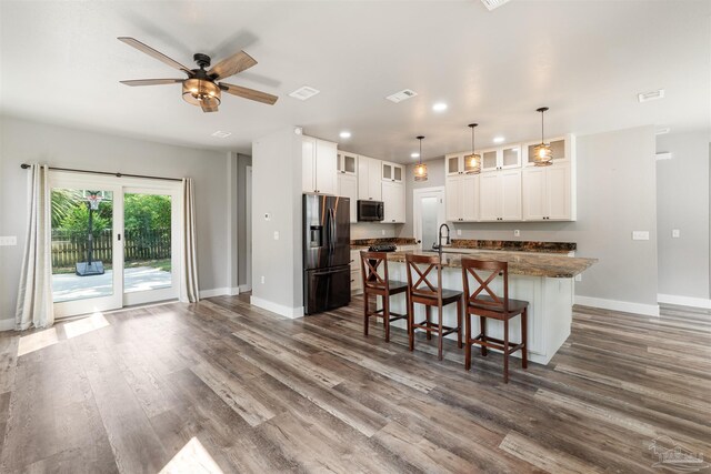 277 Seamarge Ln, Pensacola, FL 32507 - kitchen with stainless steel fridge with ice dispenser, baseboards, dark wood-style flooring, and recessed lighting
