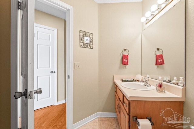 bathroom with tile patterned floors and vanity