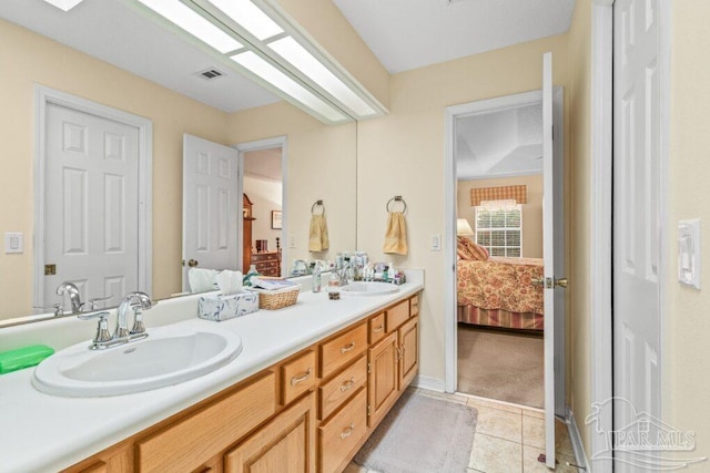 bathroom with vanity and tile patterned flooring