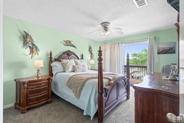 bedroom featuring light colored carpet, a textured ceiling, visible vents, and access to exterior