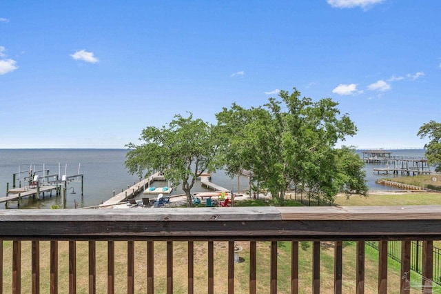 exterior space featuring a dock, boat lift, and a water view