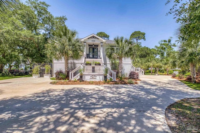 1904 Lodgepole Dr, Milton, FL 32583 - view of front of house with concrete driveway, stairway, and covered porch