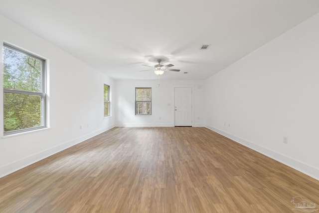 spare room featuring hardwood / wood-style floors and ceiling fan