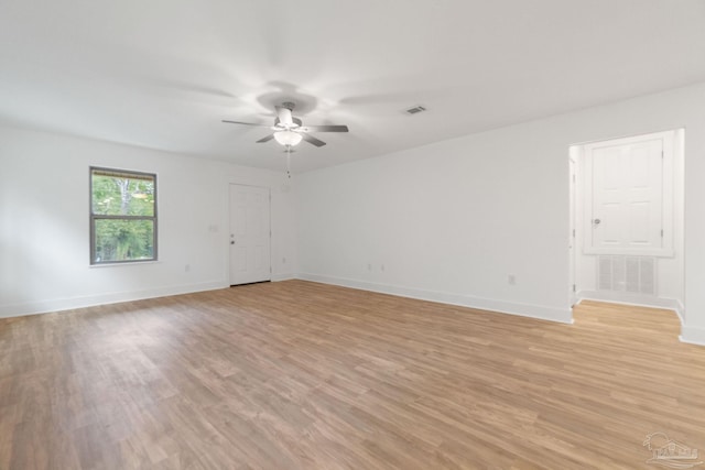 spare room featuring ceiling fan and light hardwood / wood-style floors