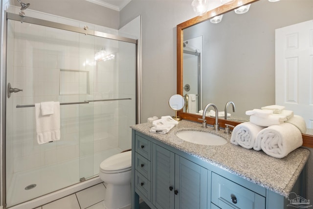 bathroom with tile patterned flooring, vanity, ornamental molding, an enclosed shower, and toilet