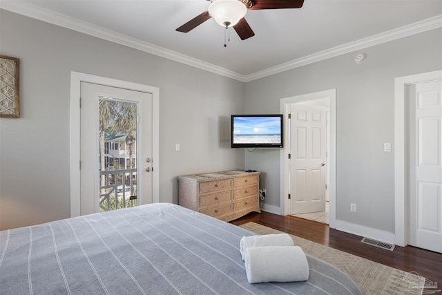 bedroom featuring ceiling fan, ornamental molding, and dark hardwood / wood-style flooring