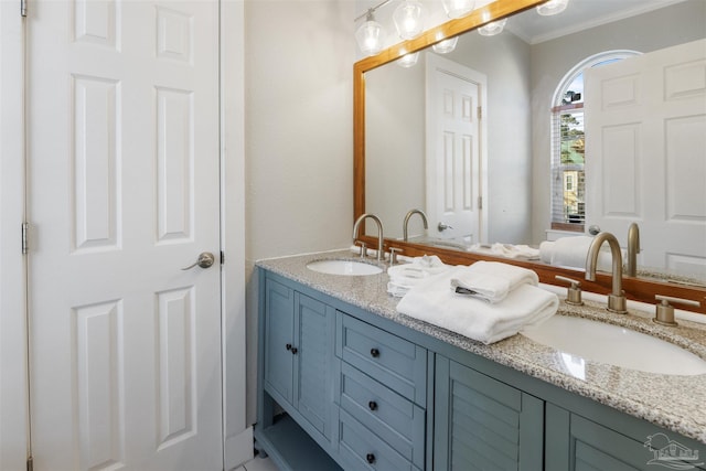 bathroom featuring vanity and ornamental molding