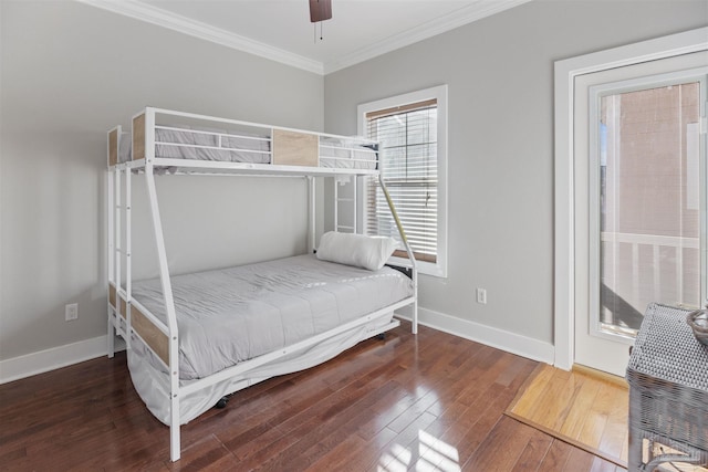 bedroom featuring crown molding, dark hardwood / wood-style floors, and ceiling fan