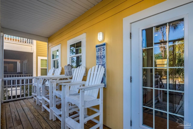 wooden terrace featuring a porch