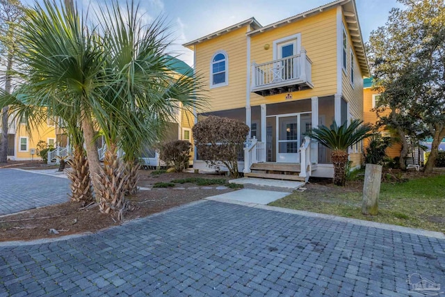 view of front of home featuring a balcony