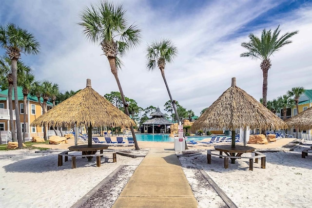 surrounding community with a gazebo and a swimming pool