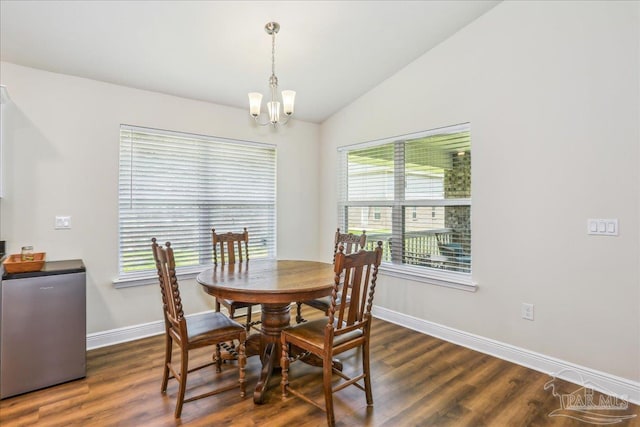 5018 Quarter Deck St, Pensacola, FL 32526 - dining area featuring a chandelier, vaulted ceiling, baseboards, and dark wood finished floors