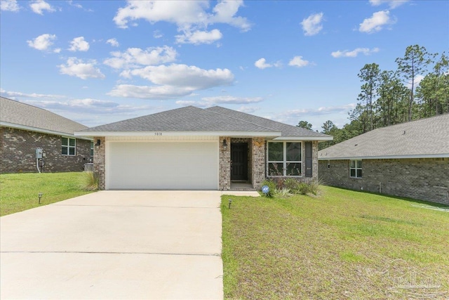 5018 Quarter Deck St, Pensacola, FL 32526 - ranch-style home with an attached garage, concrete driveway, a front lawn, and brick siding