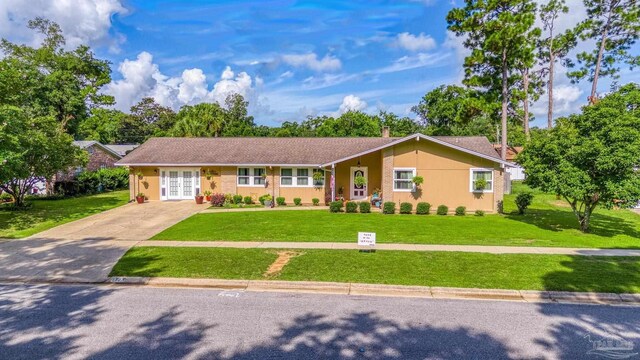 ranch-style house with a front lawn