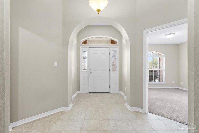 entrance foyer featuring light tile patterned floors