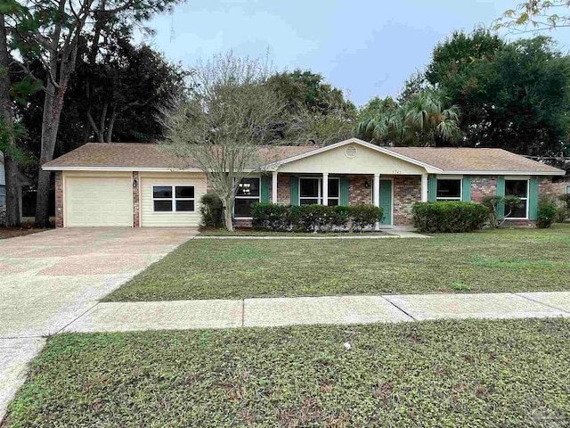 ranch-style house featuring a front yard and a garage