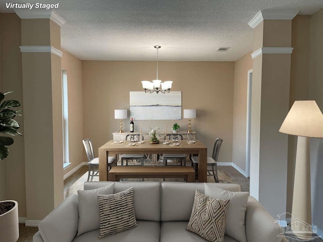 carpeted dining room featuring a textured ceiling, an inviting chandelier, and ornamental molding