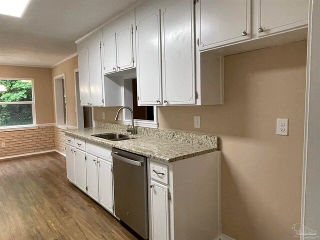 kitchen featuring dishwasher, white cabinets, dark wood-type flooring, and sink