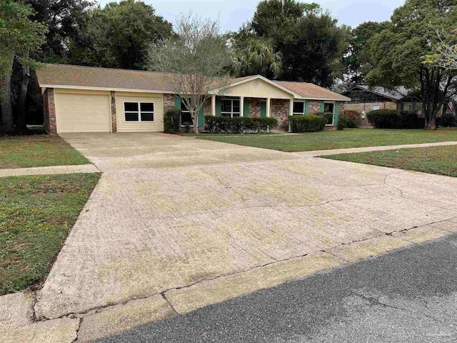 single story home with a garage and a front lawn