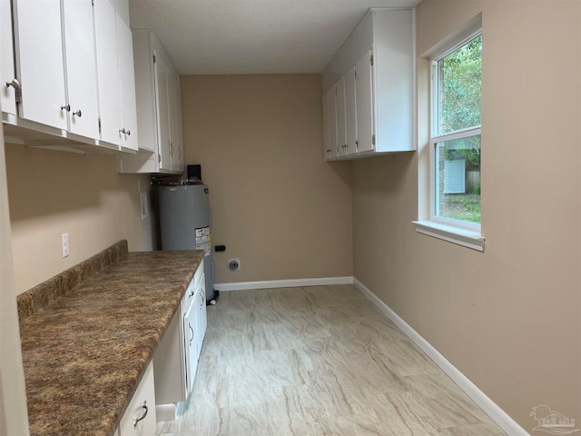 clothes washing area with electric water heater