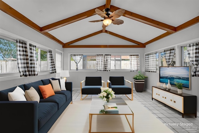 living area with a ceiling fan, lofted ceiling with beams, baseboards, and tile patterned floors