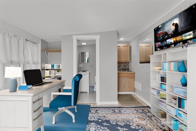 home office with washer / dryer and light tile patterned flooring