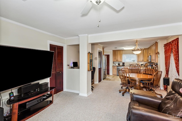 carpeted living room featuring ceiling fan with notable chandelier and ornamental molding