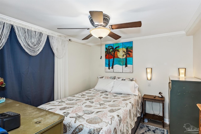 bedroom with hardwood / wood-style floors, ceiling fan, and ornamental molding