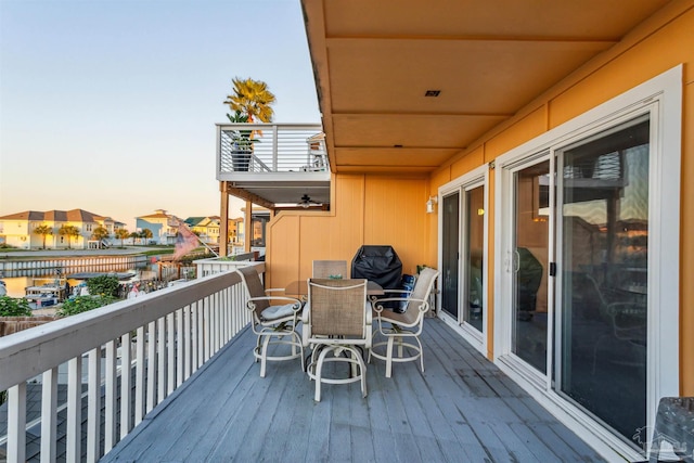 view of balcony at dusk